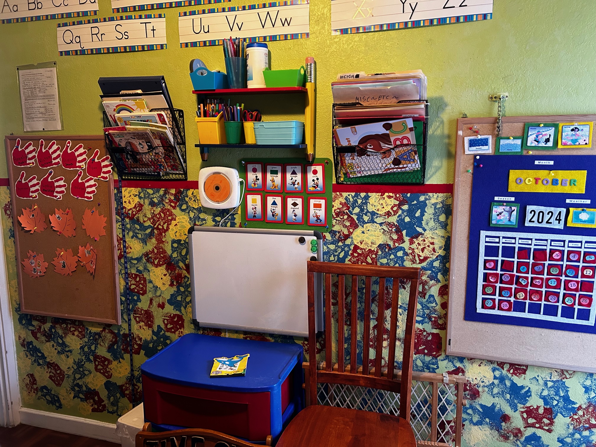 The classroom, with a whiteboard and school supplies